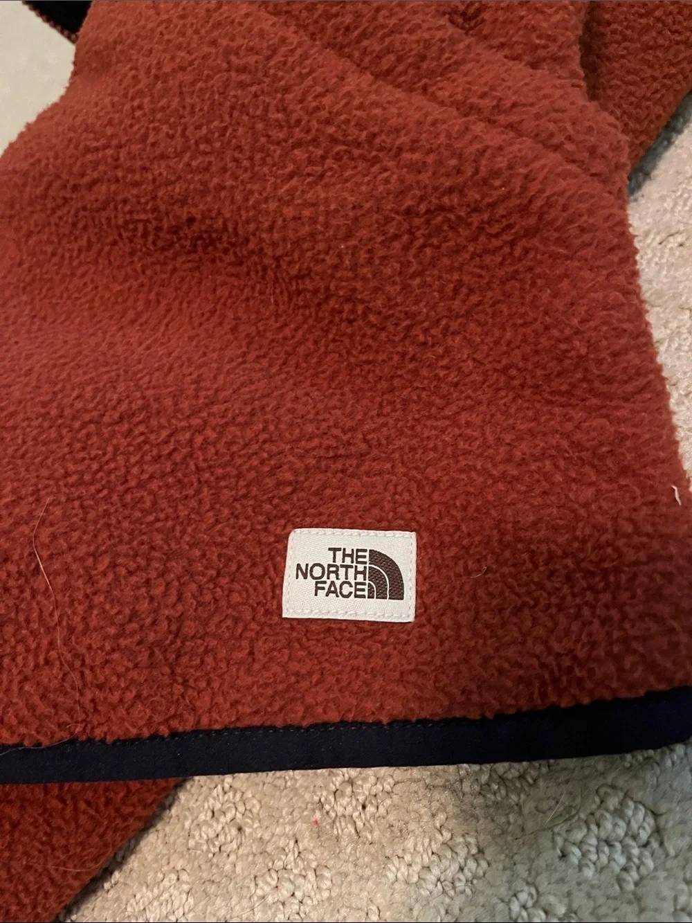 The North Face: Men's Burnt Orange Fleece Vest with Contrast Trim